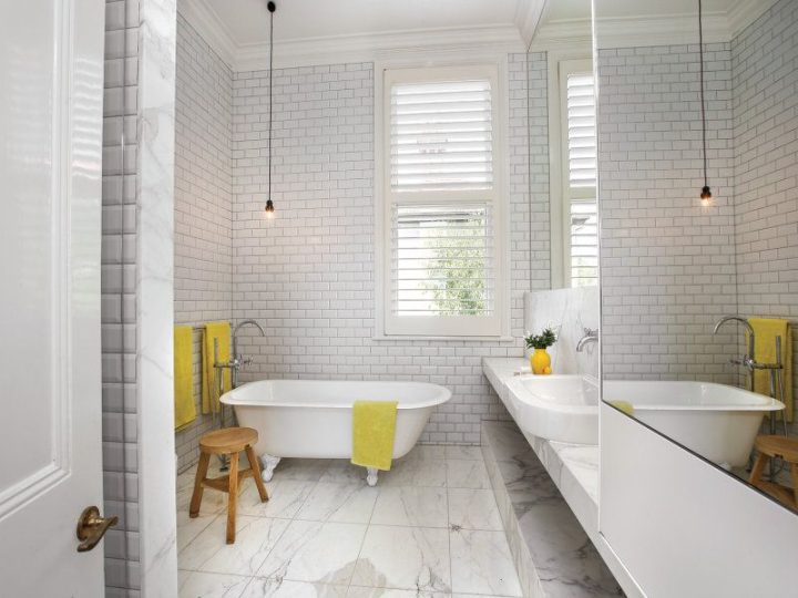 Bathroom-with-subway-tiles-and-window-pops-of-yellow