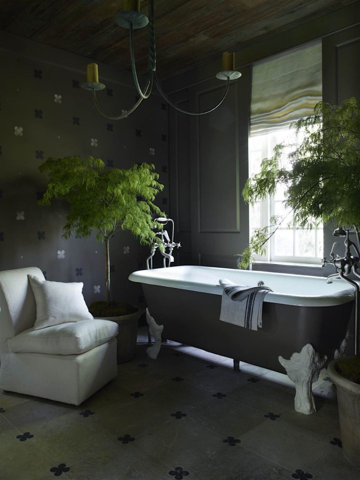 Black-bathroom-interiot-design-with-green-trees-and-clawfoot-tub