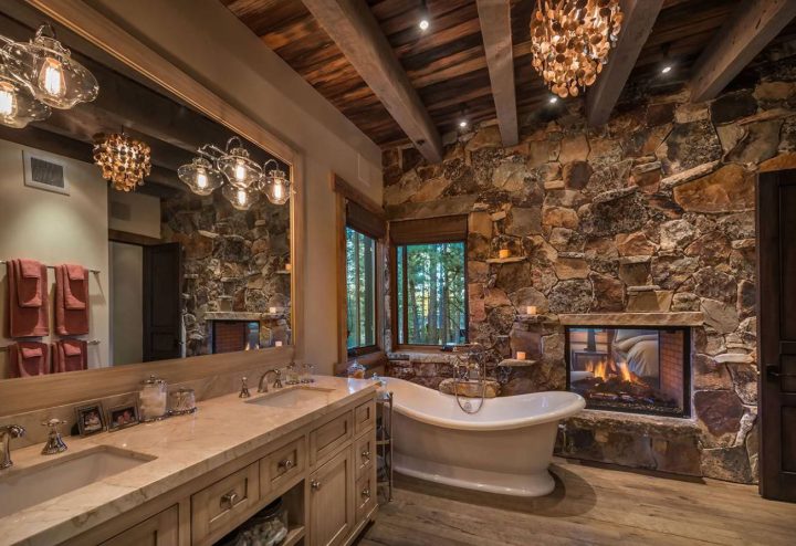 Rustic-bathroom-with-fireplace-and-clawfoot-bath