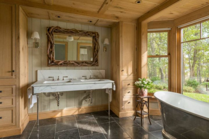 large-rustic-master-ceramic-tile-and-black-floor-freestanding-bathtub-idea-in-New-York