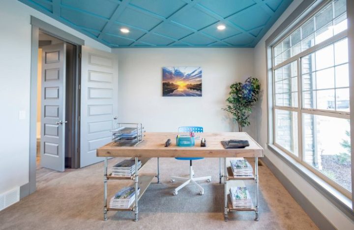 Blue-ceiling-office-design-with-pipes-legs-for-desk